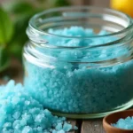 Blue salt trick ingredients blend in a glass jar with herbs and lemon zest
